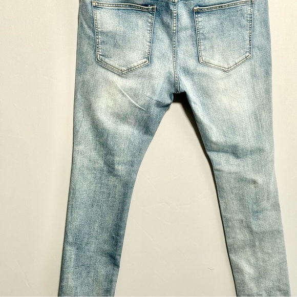 AMIRI Light Blue Skinny Jeans with Patterned Patches - Picture 3 of 10